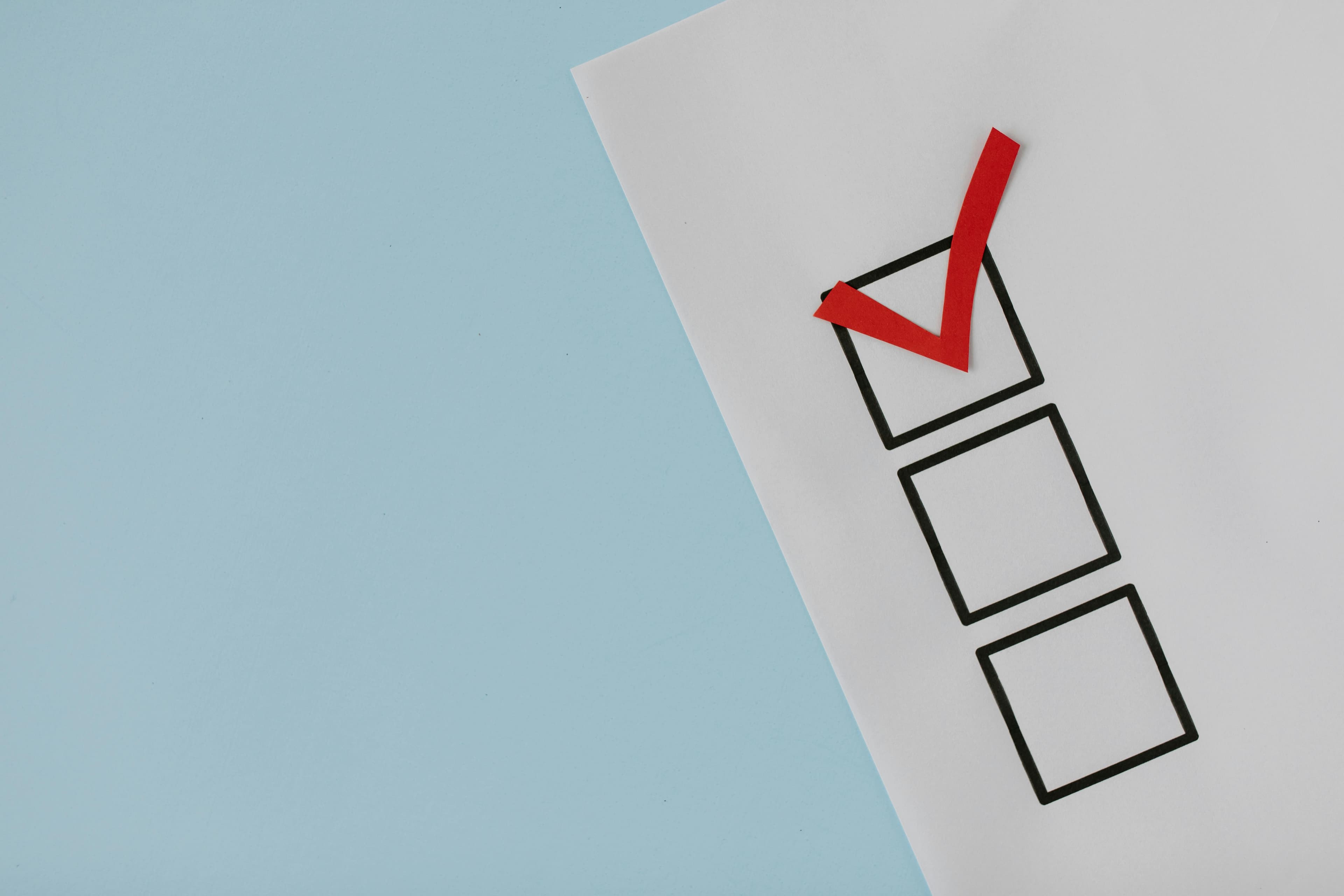 A checklist with a red checkmark in the top box, symbolizing a verified and carefully selected investment opportunity.